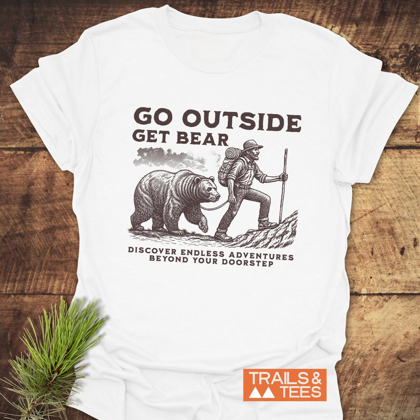 Go Outside Get Bear T-Shirt featuring a black and white drawing of a bear, and a man walking a bear, encapsulating adventure and nature.