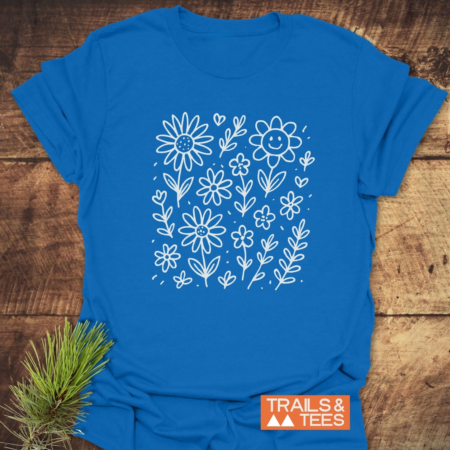 Wildflower Smiles T-Shirt featuring a delicate floral design on the front, short sleeves, and a comfortable fit, ideal for active or casual wear.