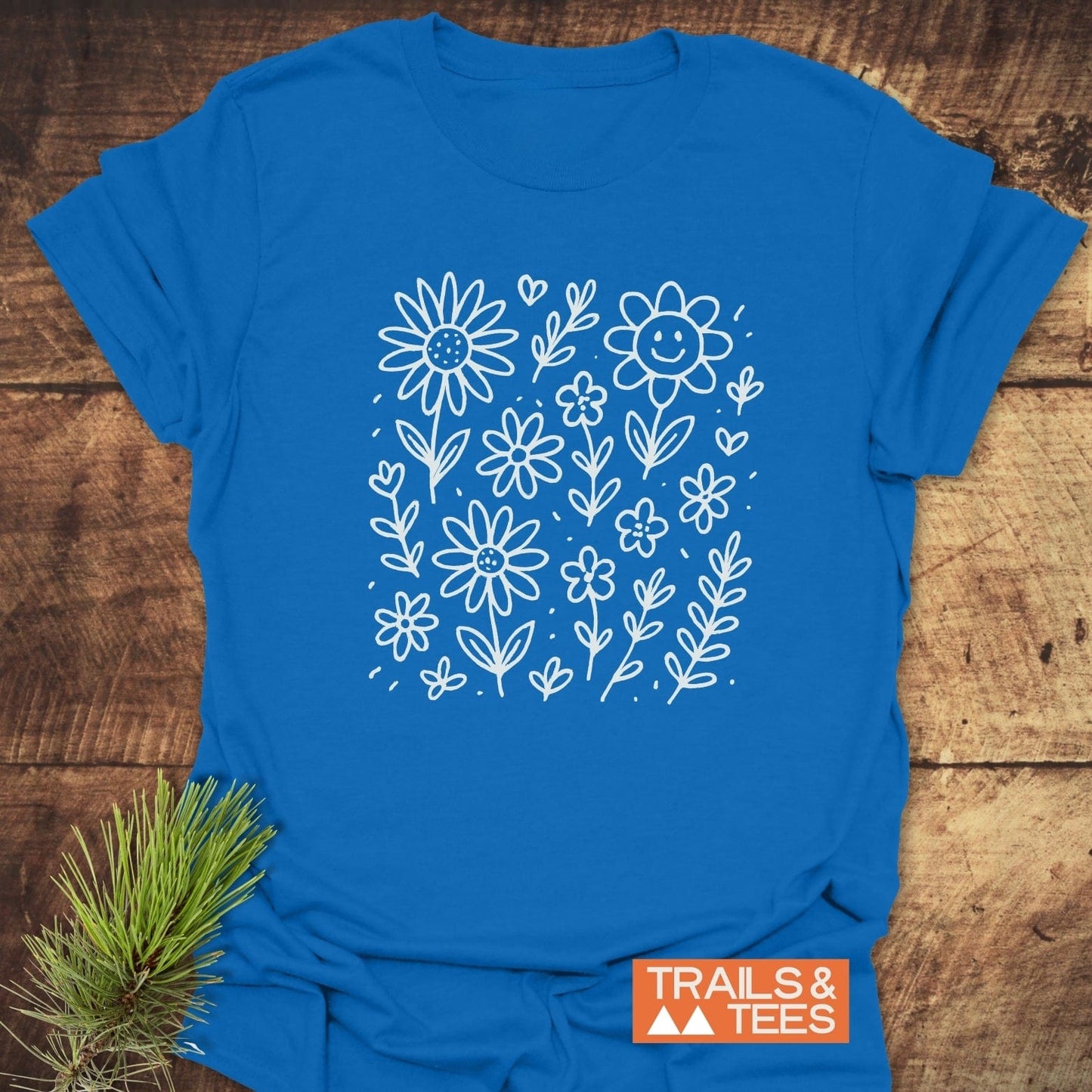 Wildflower Smiles T-Shirt featuring a delicate floral design on the front, short sleeves, and a comfortable fit, ideal for active or casual wear.