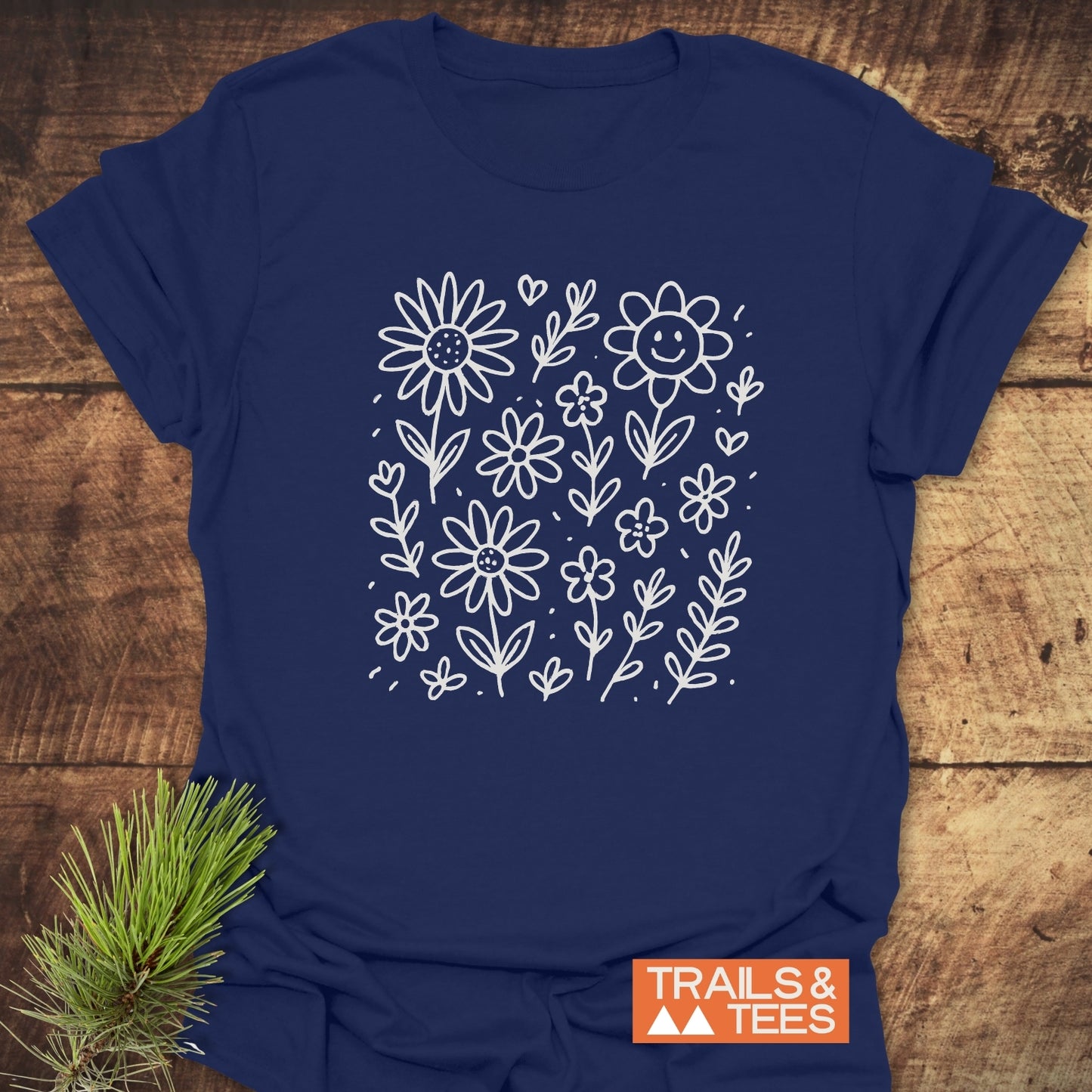 Wildflower Smiles T-Shirt showcasing a delicate white flower design, ideal for active wear, combining comfort and style, perfect for casual outings or workouts.