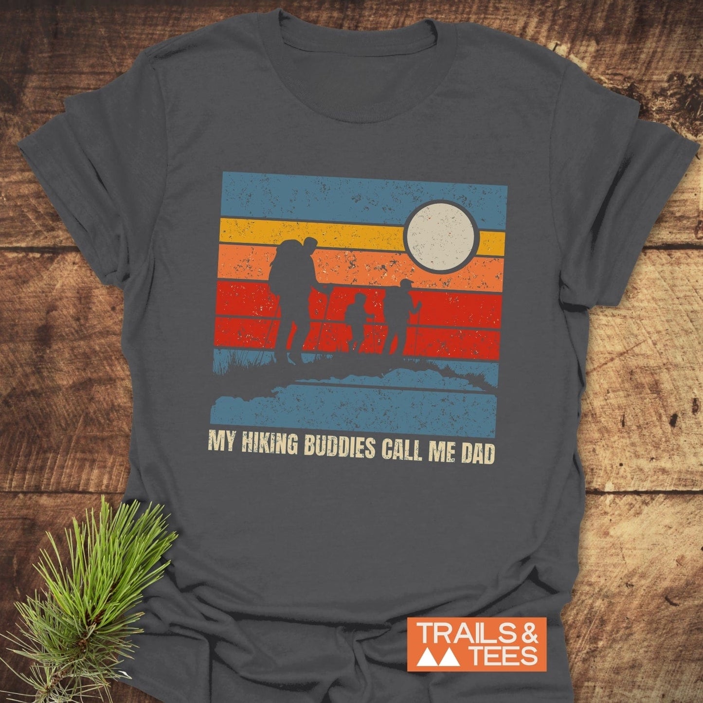 My Hiking Buddies Call Me Dad T-Shirt featuring bold text, ideal for outdoor enthusiasts, captured with a close-up of the design on an active t-shirt.