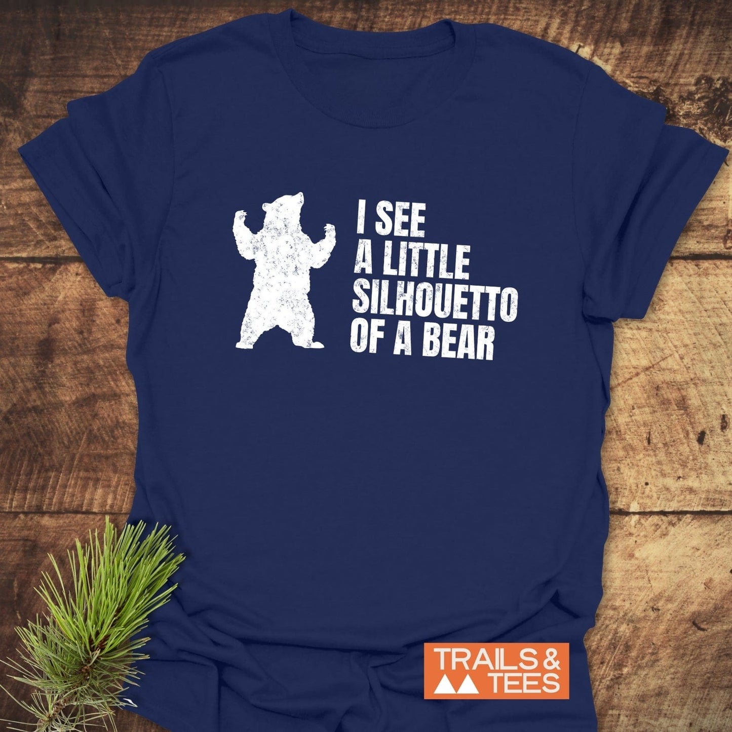 Close-up of I See A Little Silhouetto Of A Bear T-shirt featuring a bear graphic and text, highlighting its playful design and active wear style.