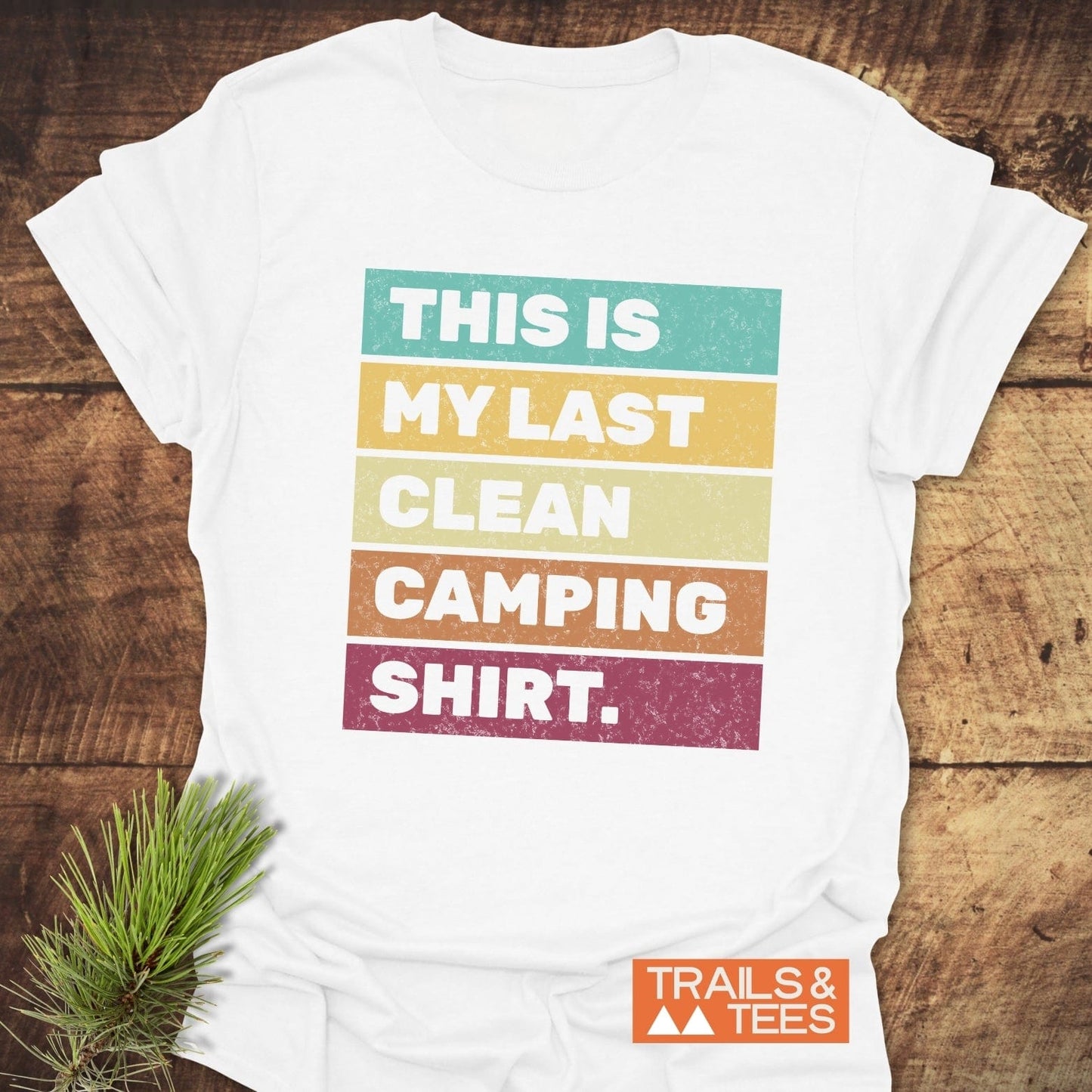 My Last Clean Camping Shirt close-up with white text on a brown sign, featuring subtle plant elements, showcasing the shirt's playful, outdoorsy theme.