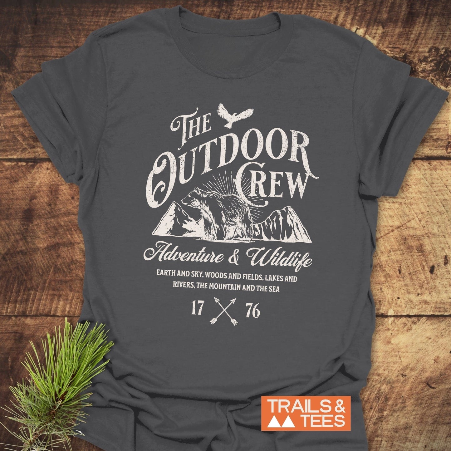The Outdoor Crew Vintage T-Shirt features durable white text on a grey tee, crafted from soft, lightweight cotton for comfort and adventure.