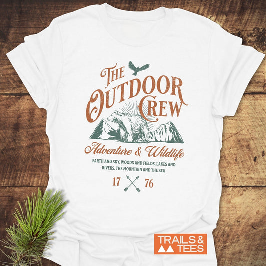 The Outdoor Crew Vintage T-Shirt, featuring a close-up of its soft, lightweight fabric, showcasing durable prints and no side seams for lasting shape.