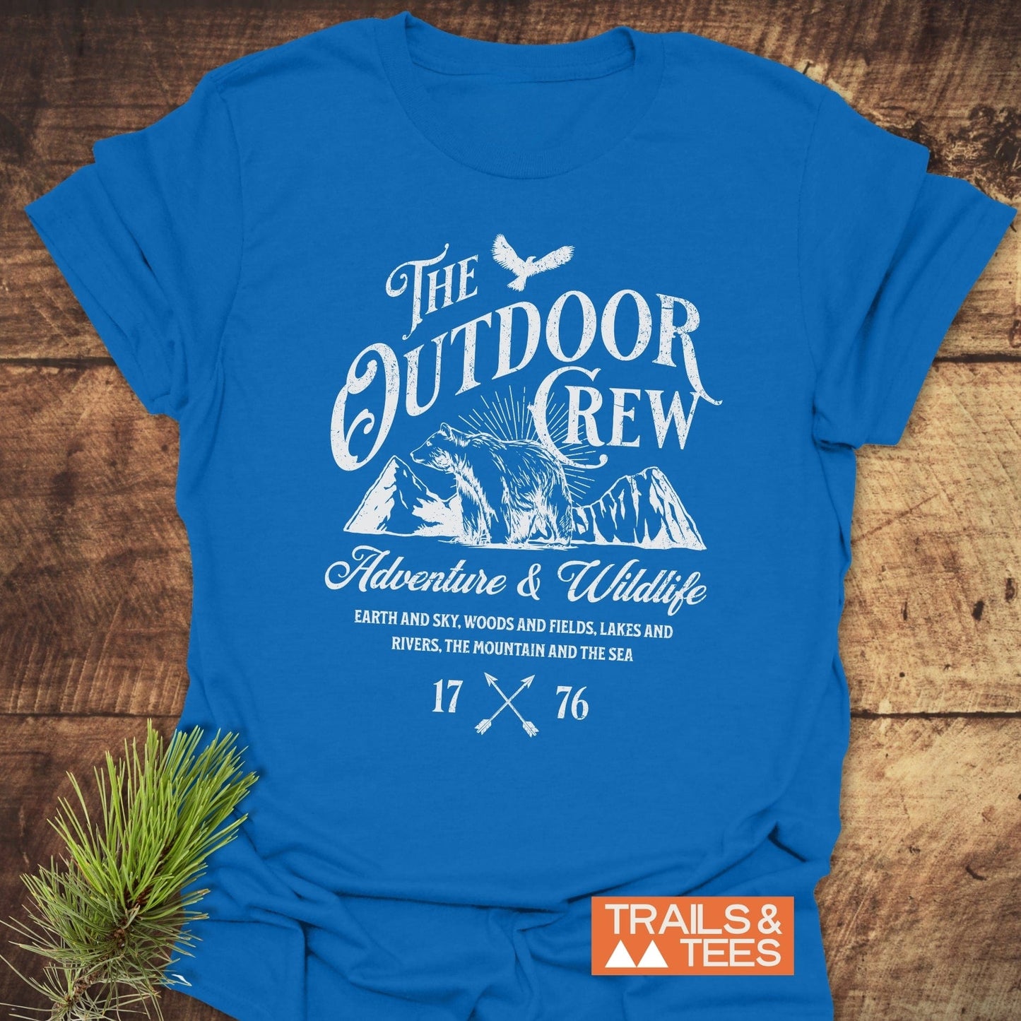 The Outdoor Crew Vintage T-Shirt with white text on blue, crafted from soft, ring-spun cotton, designed for comfort and outdoor adventures.