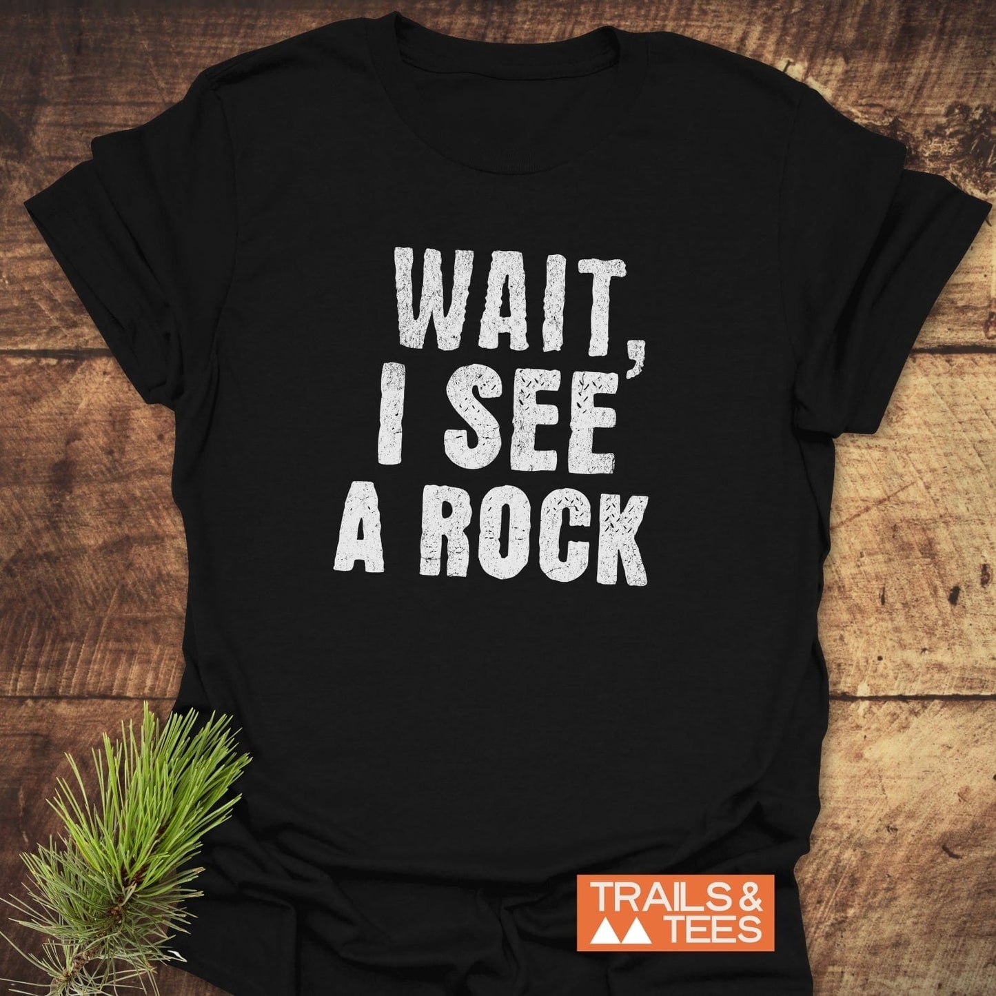 Wait, I See A Rock T-Shirt featuring white text on black, crafted from lightweight cotton for comfort and durability, ideal for outdoor adventures.