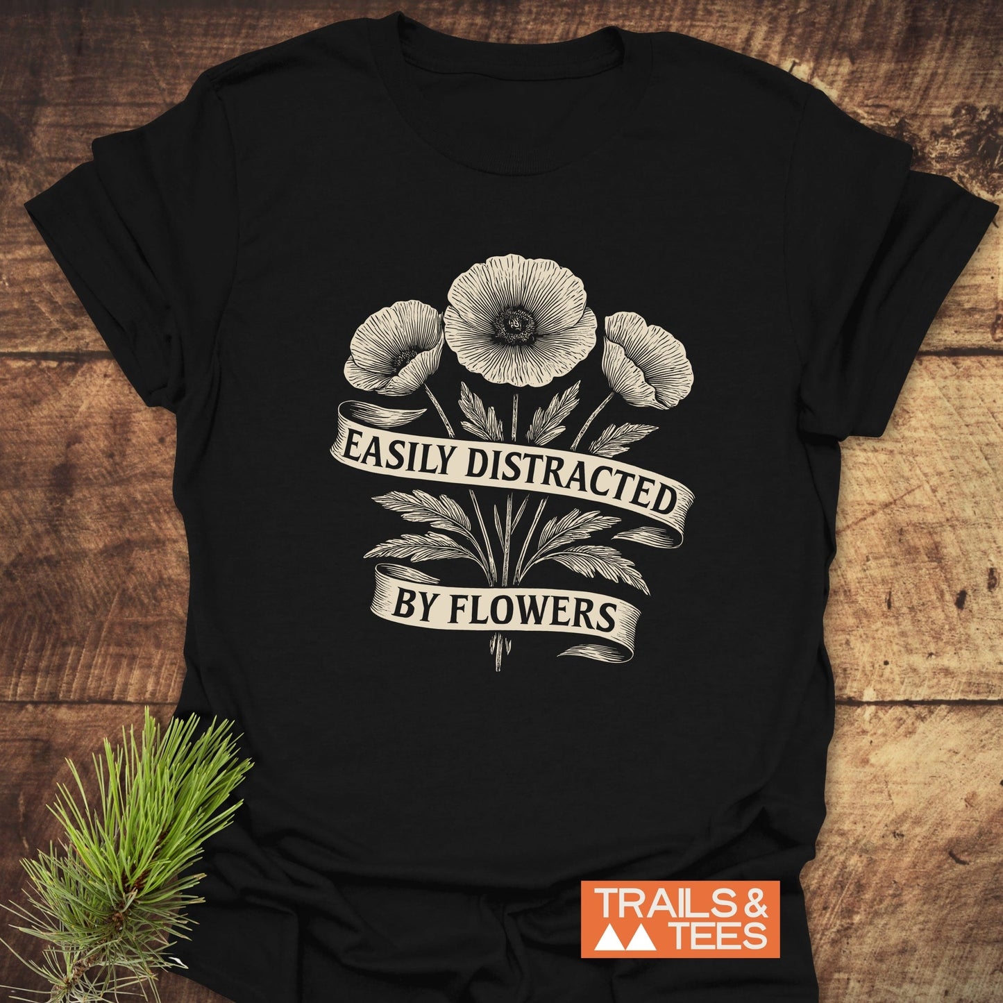 Easyly Distracted By Flowers T-Shirt featuring a black base with white floral design, crafted from soft, lightweight cotton for comfort and durability.
