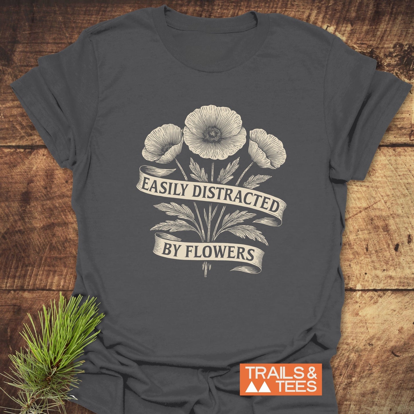 Easyly Distracted By Flowers T-Shirt featuring a grey background adorned with white floral designs, made from soft, lightweight, ring-spun cotton for outdoor adventures.