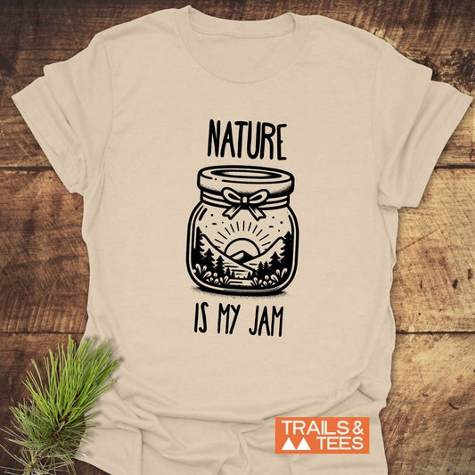 Nature Is My Jam T-Shirt featuring a detailed black and white jar illustration with mountains and trees, crafted from soft, lightweight ring-spun cotton for everyday adventures.