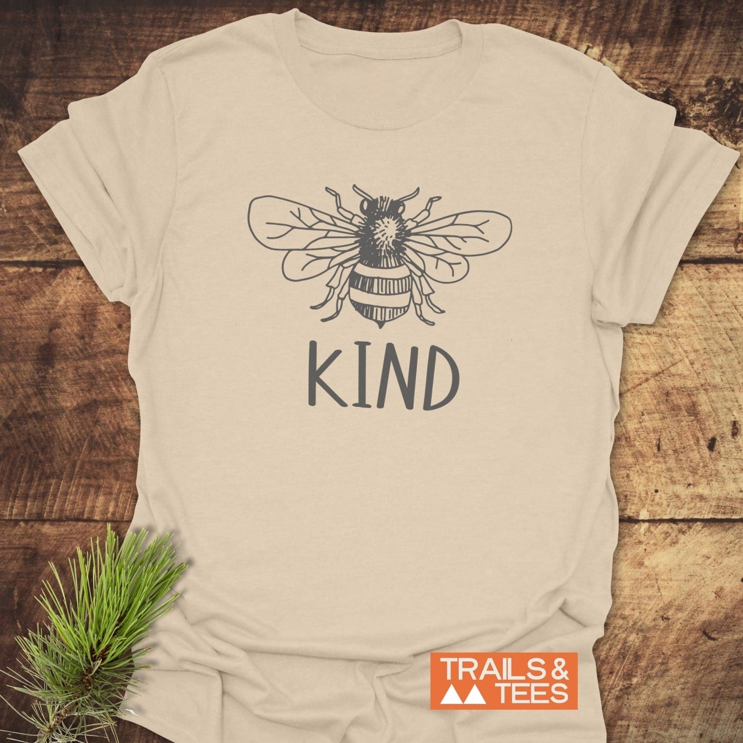 Bee Kind T-Shirt featuring a bee illustration, crafted from soft ring-spun cotton for comfort, designed for outdoor adventures with durable, crack-resistant prints.