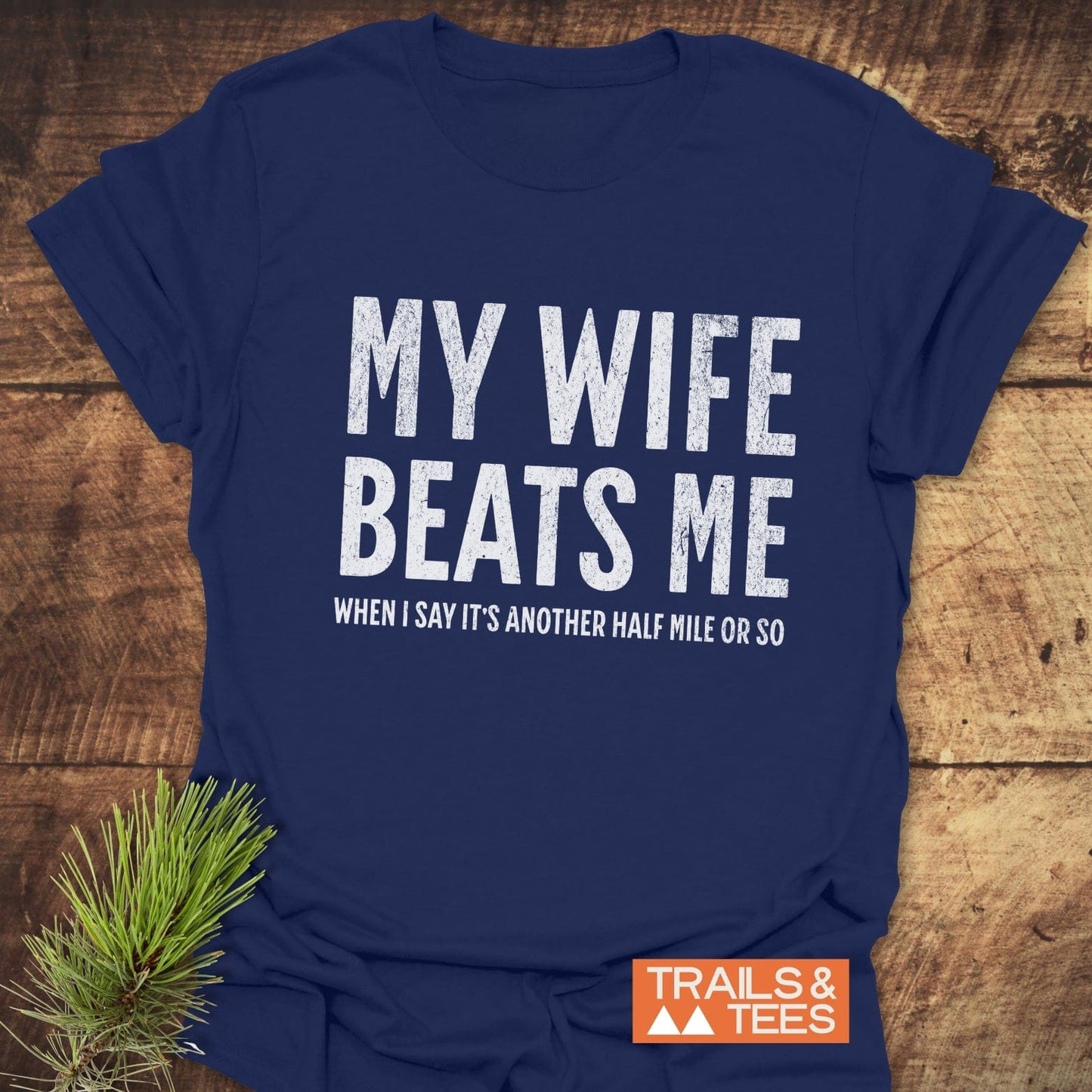 My Wife Beats Me T-Shirt, crafted from soft, lightweight cotton with durable prints, designed for comfort and adventure, perfect for outdoor enthusiasts.