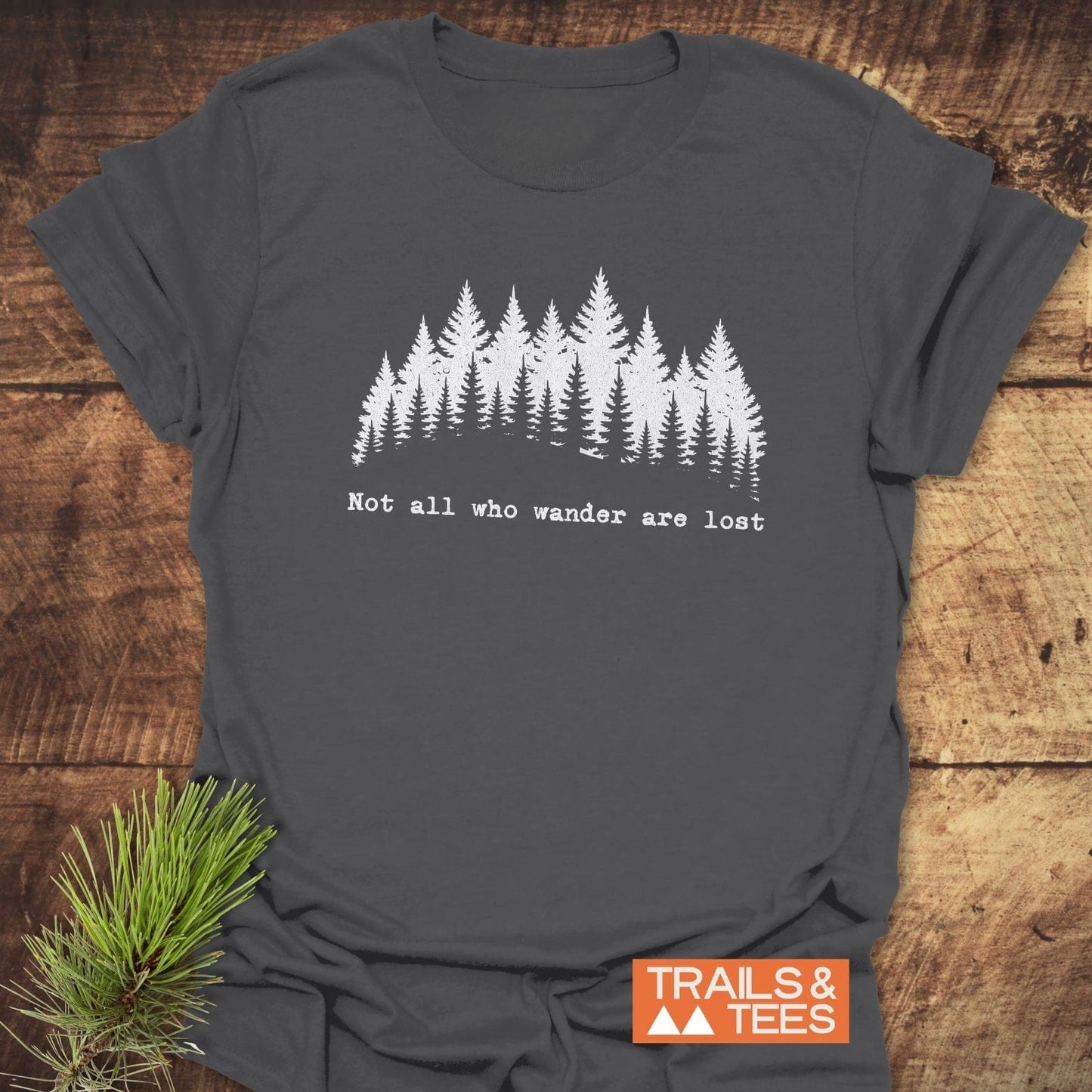 Not All Who Wander T-Shirt featuring a graphic tree design, crafted from soft, lightweight ring-spun cotton for comfort and durability, ideal for outdoor enthusiasts.