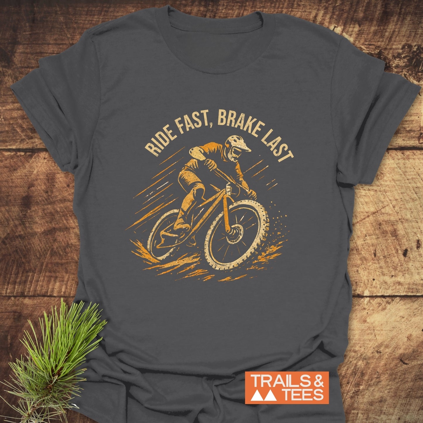 Ride Fast Brake Last T-Shirt featuring a print of a man riding a bike, crafted from lightweight cotton, designed for comfort and adventure.