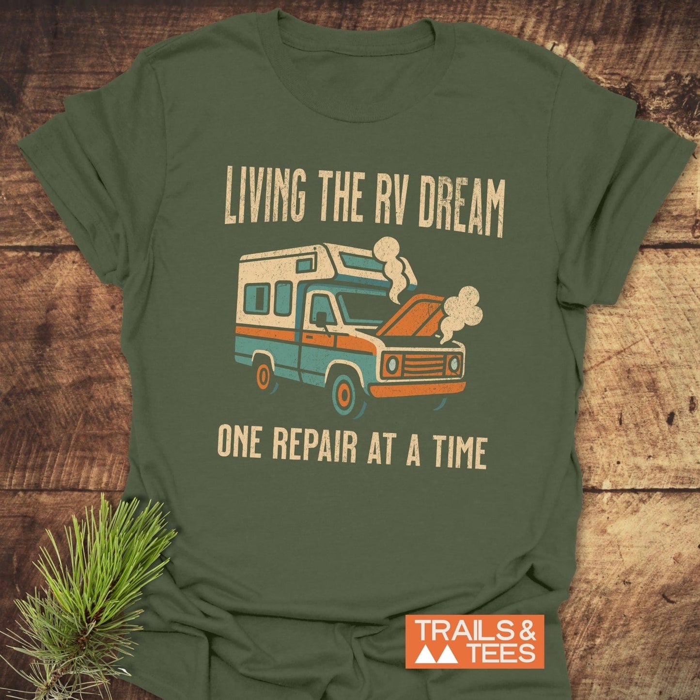 Living The RV Dream T-Shirt featuring white text and a camper graphic, perfect for enthusiasts who love the RV lifestyle.