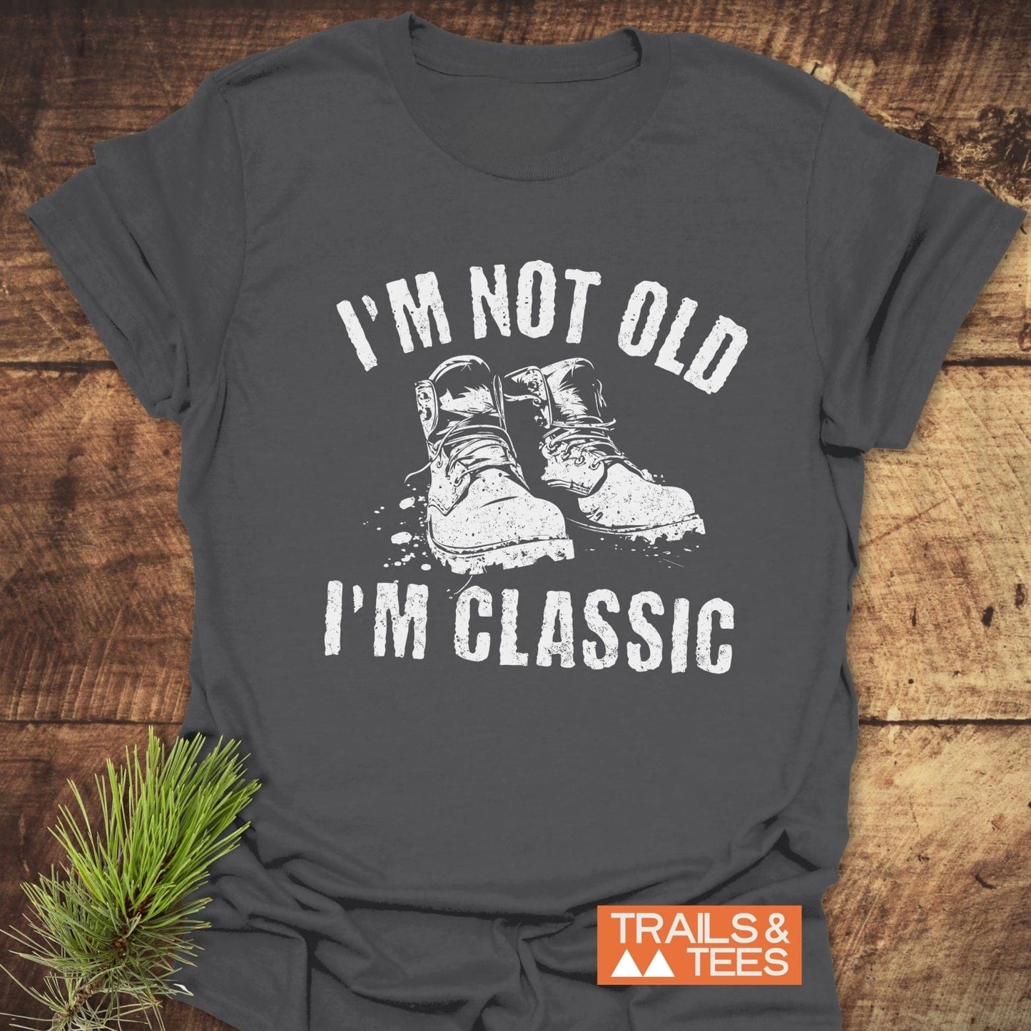 I'm Not Old I'm Classic T-Shirt featuring bold white text and a pine branch design, highlighting its casual style.