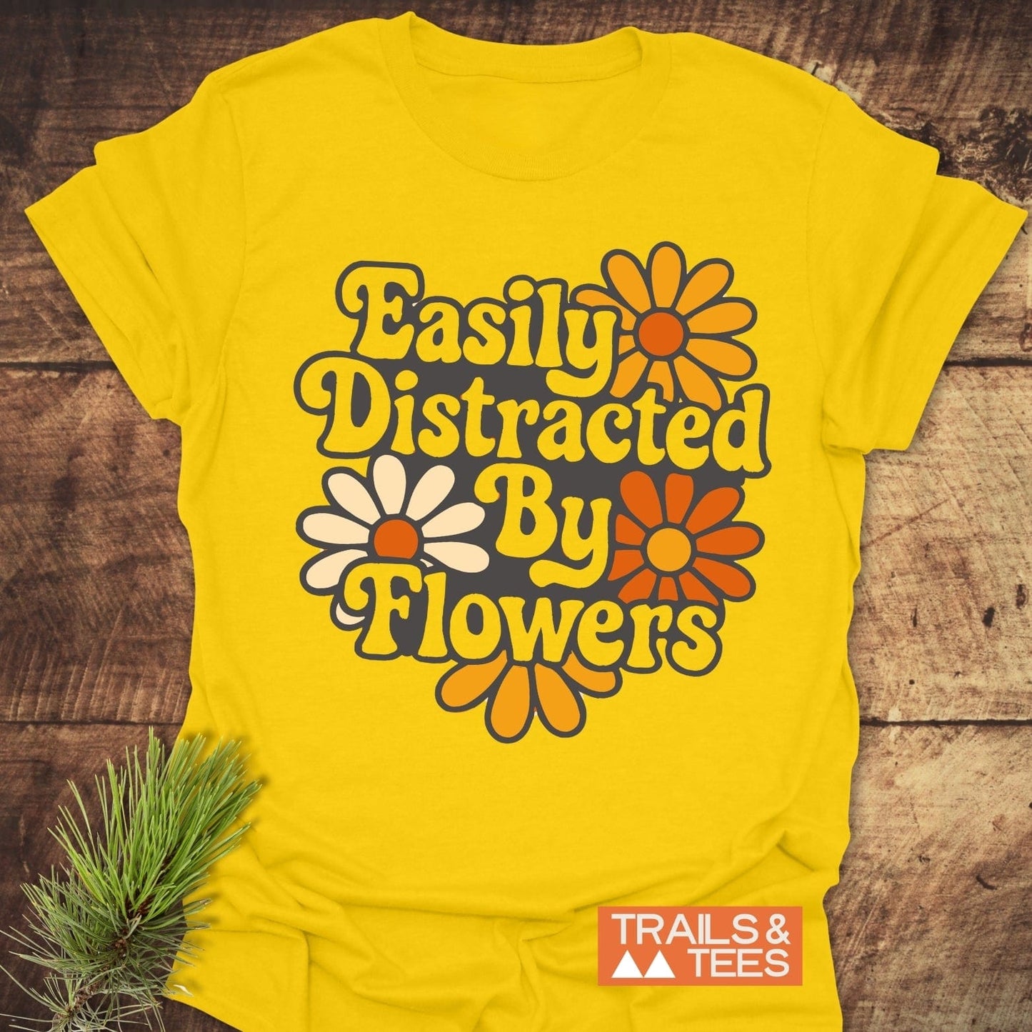 Easily Distracted By Flowers T-Shirt with bold text, crafted from soft cotton for comfort and durability, ideal for outdoor enthusiasts.