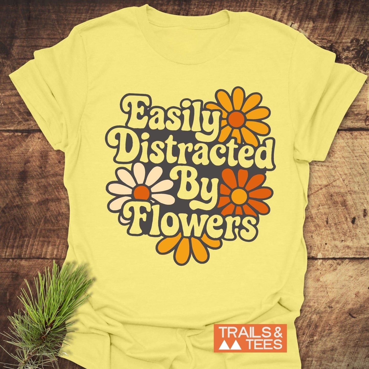 Easily Distracted By Flowers T-Shirt featuring floral and text design on lightweight cotton, ideal for outdoor enthusiasts. Durable, pre-shrunk, and printed on demand.