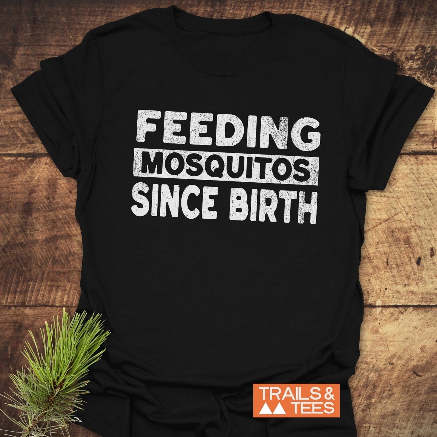 Feeding Mosquitos T-Shirt featuring durable white text on black, crafted from soft, lightweight cotton. Perfect for outdoor adventures and everyday comfort.