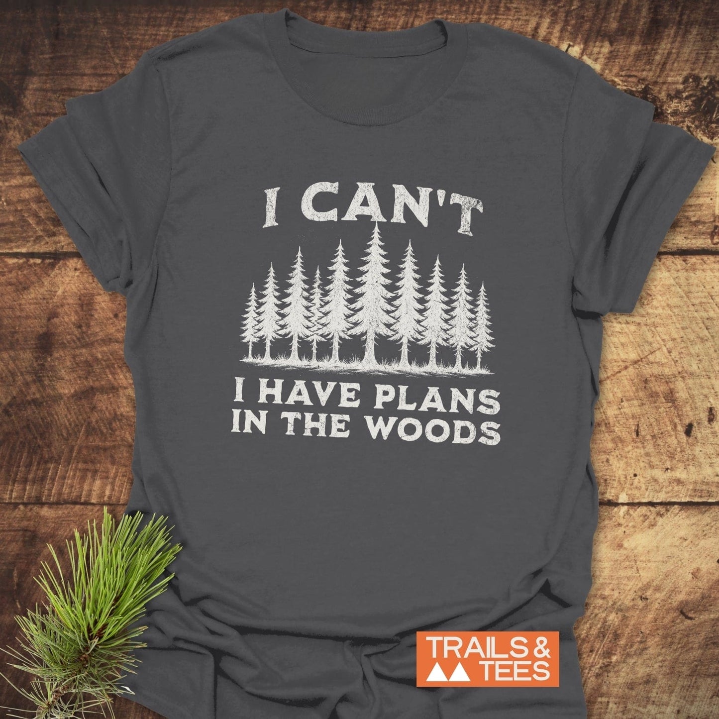 I Can't I Have Plans T-Shirt, showcasing durable white text on a grey tee, perfect for outdoor enthusiasts, made with soft ring-spun cotton for comfort.