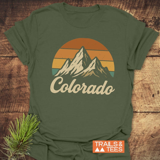 Colorado Sunset T-Shirt featuring a mountain and pine branch design, ideal for activewear. Perfectly captures nature's essence in a comfortable, stylish top.