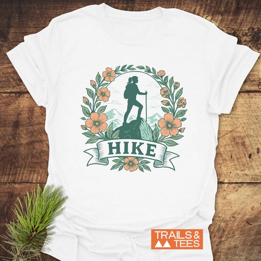 HIKE Flower T-Shirt featuring a woman and floral design, crafted from soft cotton for outdoor enthusiasts, with durable prints and pre-shrunk fit.