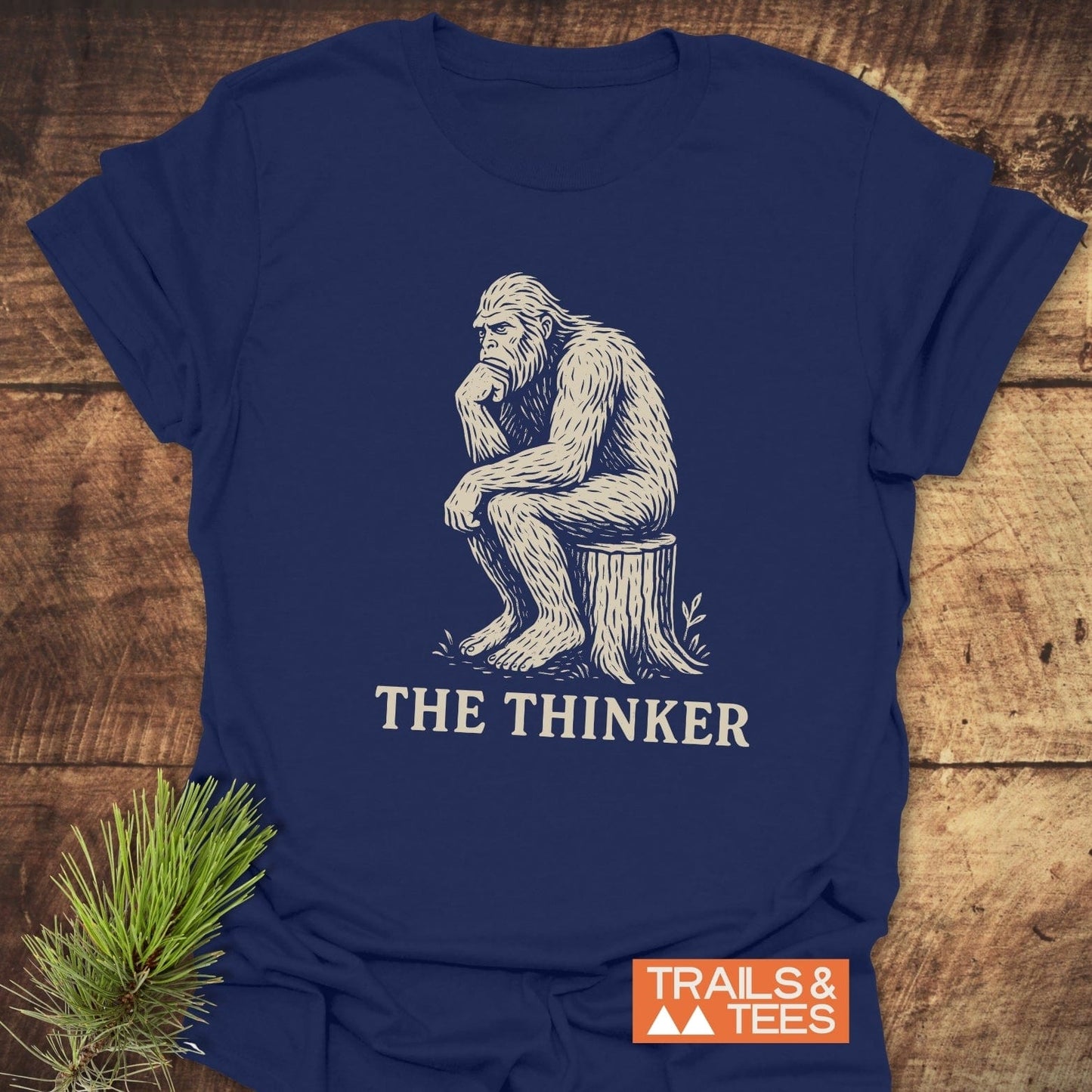 Bigfoot The Thinker T-Shirt featuring a gorilla illustration on a tree stump, crafted from ring-spun cotton for comfort and durability.