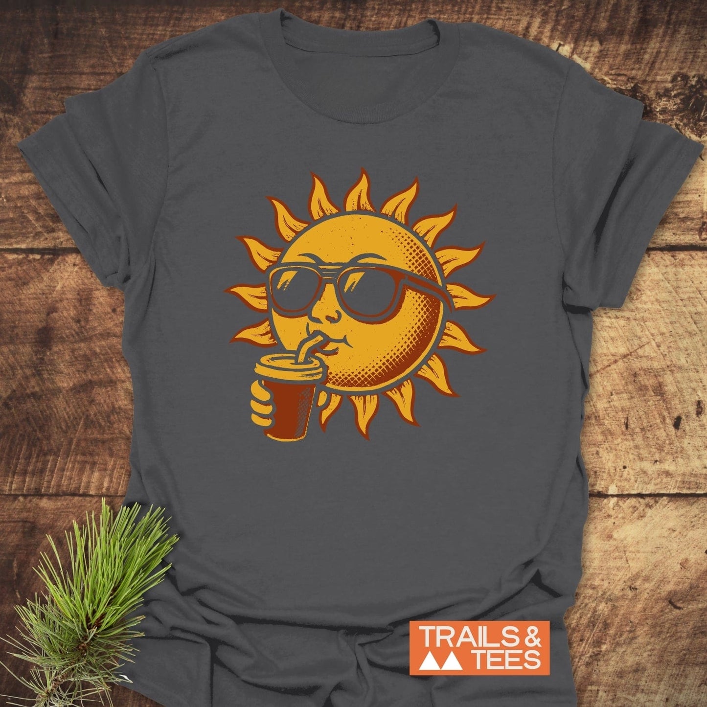 Sun With Coffee T-Shirt featuring a sun wearing sunglasses, sipping from a straw. Made from soft, lightweight cotton for comfortable, everyday outdoor adventures.