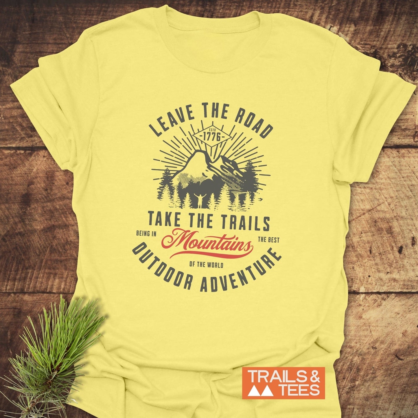 Leave The Road T-Shirt featuring bold lettering on a vibrant sign-inspired design, merging casual style with an active look.