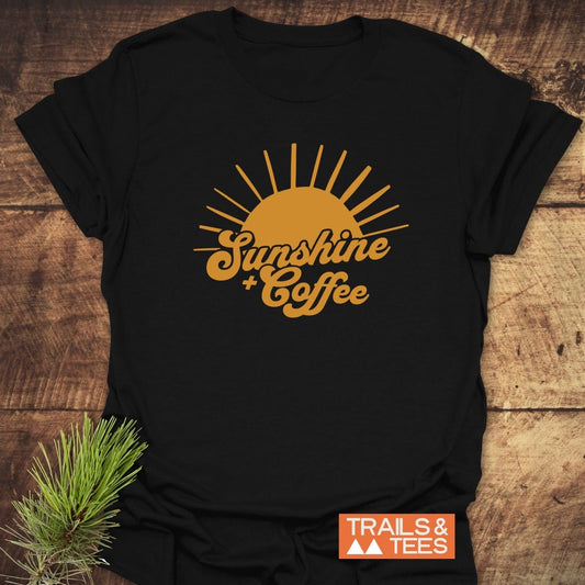 Sunshine And Coffee T-Shirt with a yellow sun design on a black tee, crafted from soft cotton for outdoor comfort and durability.