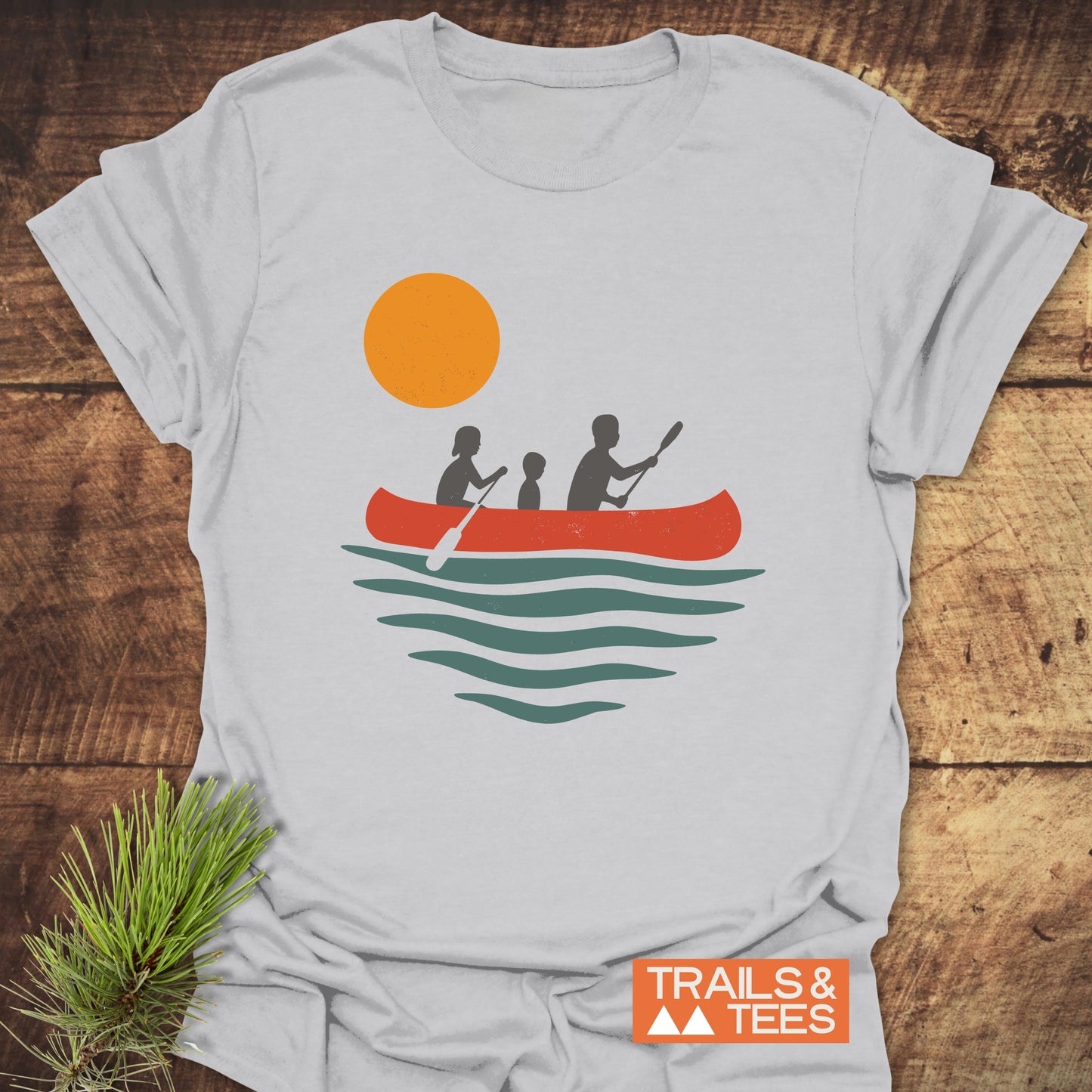 Family Canoe T-Shirt featuring silhouettes of a child and boy with a paddle, crafted from soft cotton for everyday outdoor adventures, offering durability and comfort.