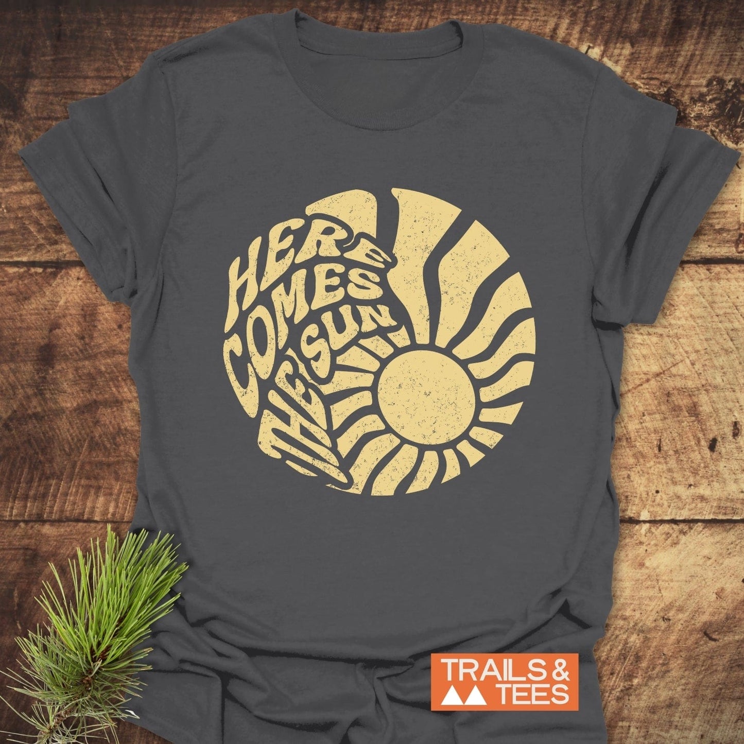 Here Comes The Sun T-Shirt featuring a graphic design on grey fabric, crafted from lightweight cotton for comfort and durability, ideal for outdoor adventures.