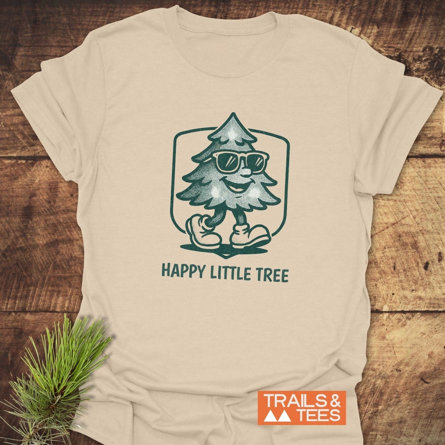 Happy Little Tree T-Shirt featuring a cartoon Christmas tree with sunglasses, crafted from soft ring-spun cotton, perfect for outdoor adventures and everyday comfort.