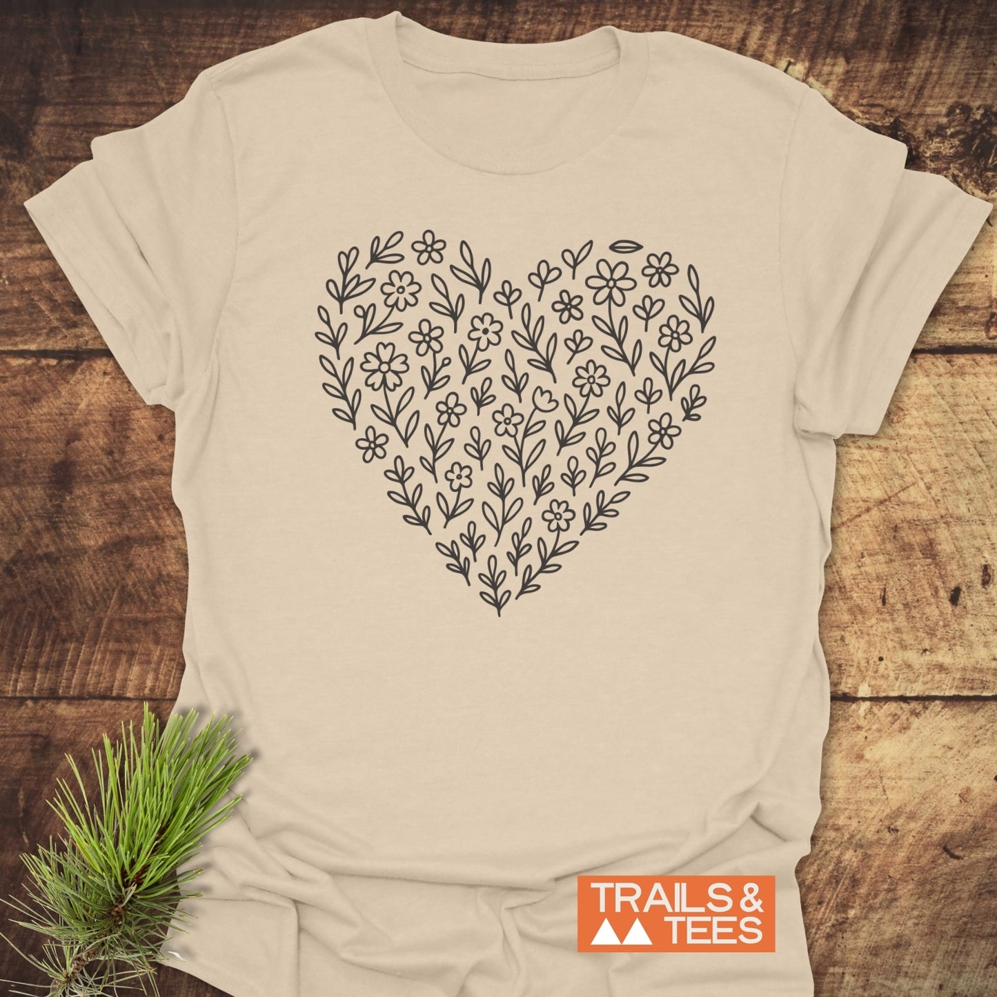 Flower Heart T-Shirt featuring a heart design on soft, lightweight ring-spun cotton, ideal for outdoor adventures. Durable print, pre-shrunk for lasting fit.