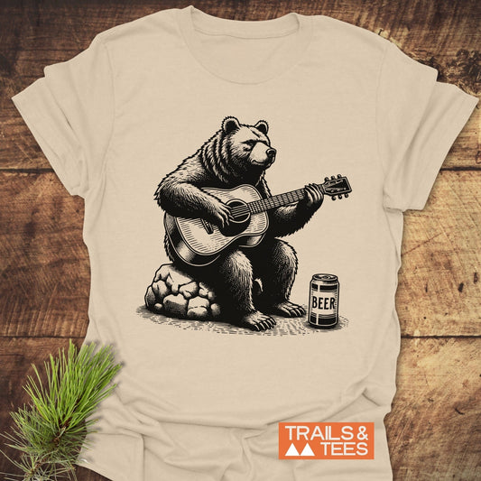 Bear Playing Guitar T-Shirt featuring a whimsical bear graphic strumming a guitar, perfect for music lovers seeking a fun, casual clothing option.