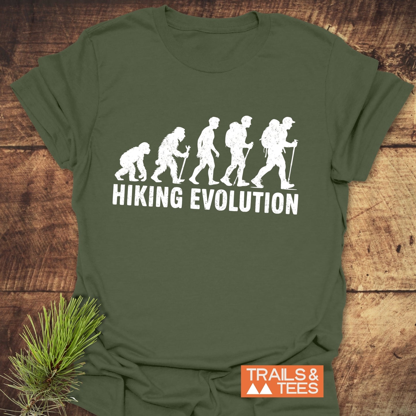 Hiking Evolution T-Shirt featuring silhouettes of a person and a backpack, symbolizing the progression of outdoor adventure. Ideal for active enthusiasts.