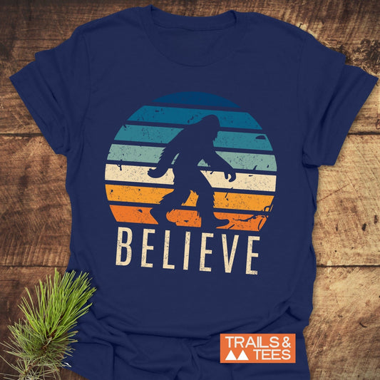 Believe Bigfoot T-Shirt featuring a logo on the front, ideal for active wear enthusiasts.