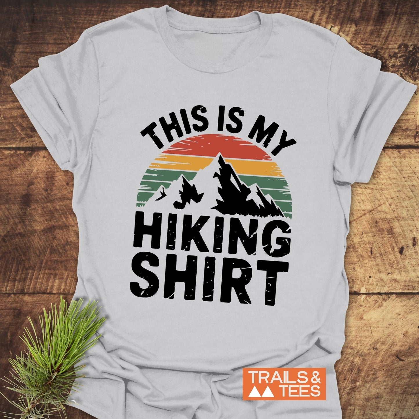 This Is My Hiking Shirt T-Shirt featuring a mountain graphic and text design, ideal for outdoor enthusiasts and activewear, displayed as a product image.