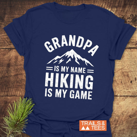 Grandpa Is My Name Hiking Is My Game T-Shirt, featuring bold white text, designed as an activewear shirt perfect for hiking enthusiasts.
