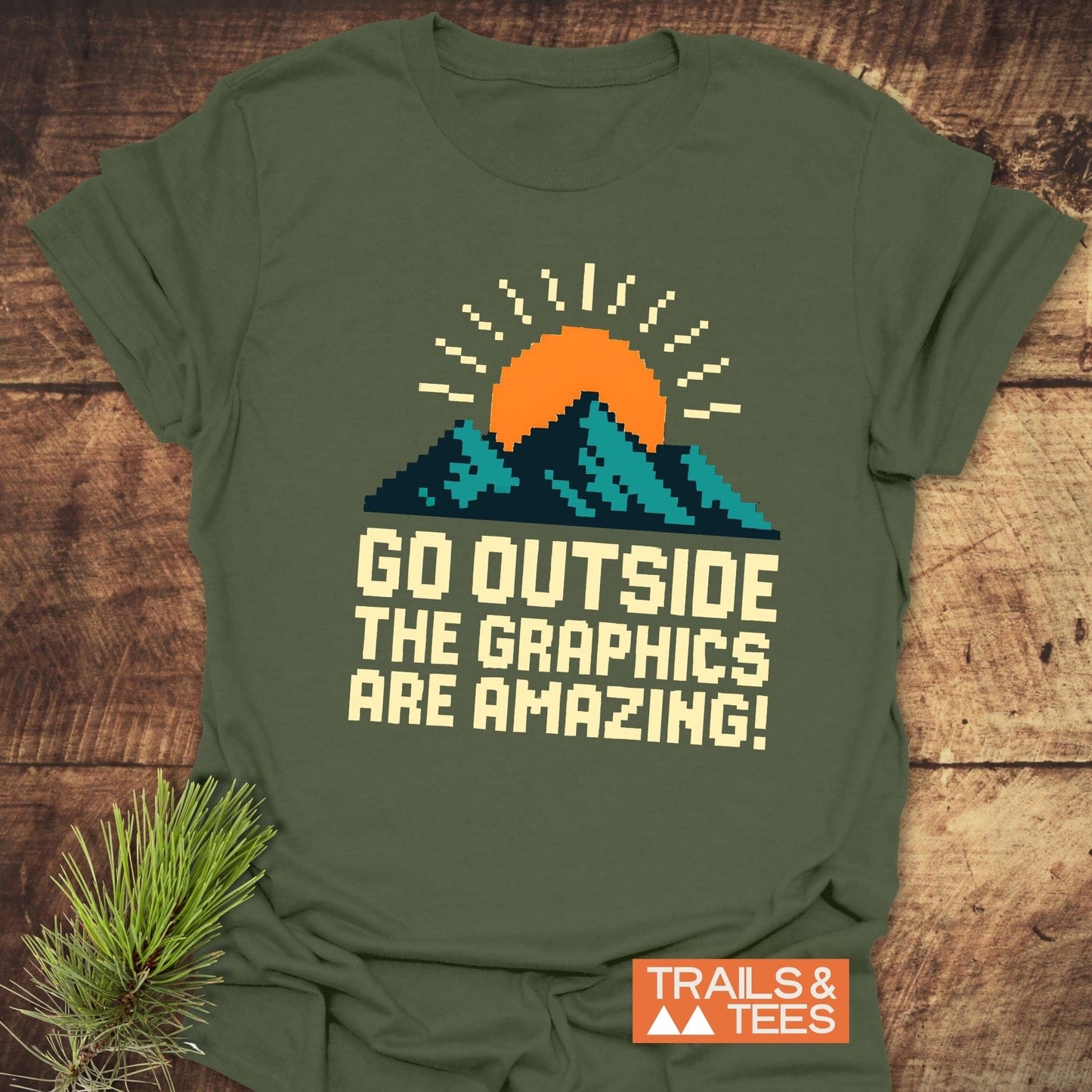 Go Outside Pixelart Mountain T-Shirt featuring a vibrant mountain and sun design, crafted from soft ring-spun cotton for comfort during outdoor adventures.