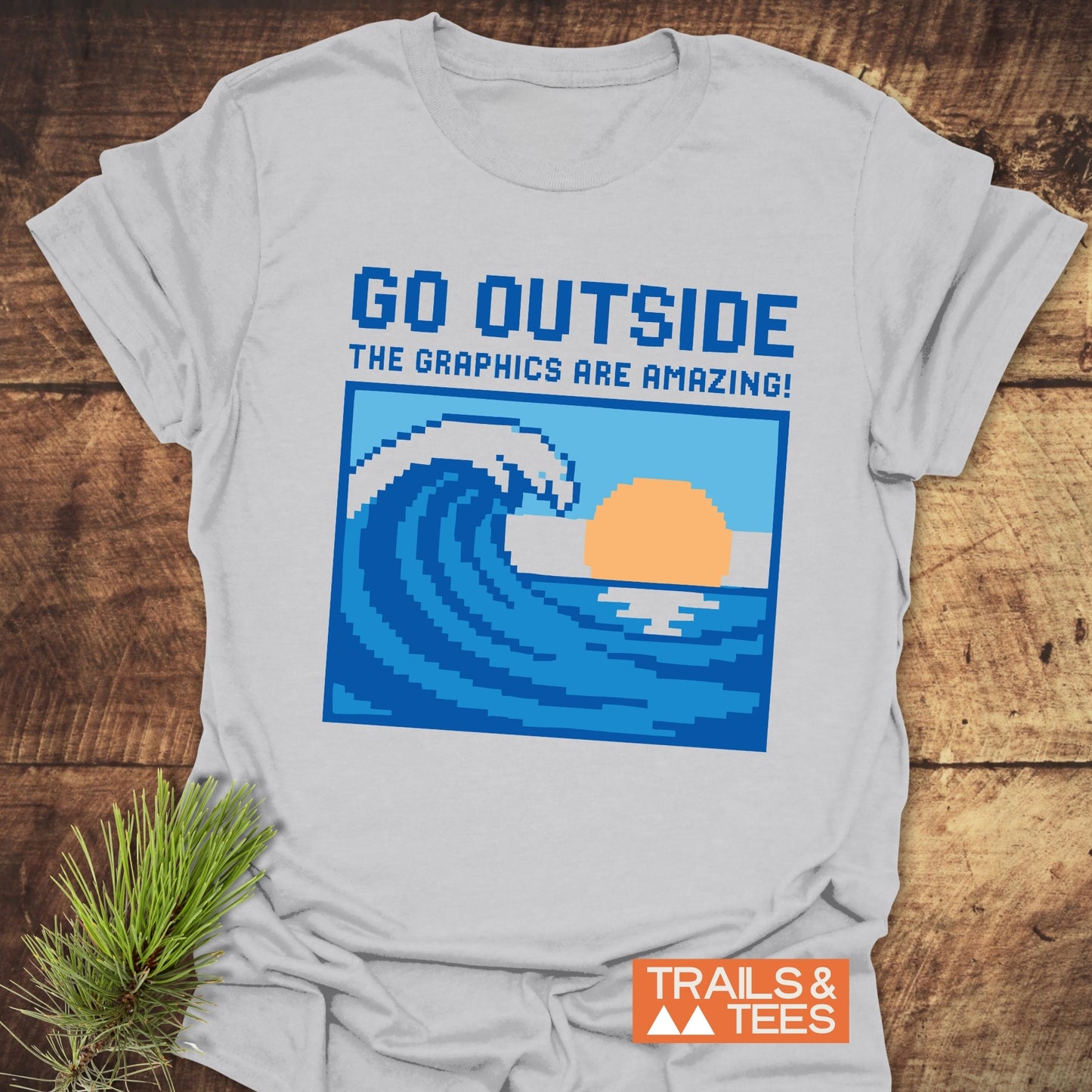 Go Outside Pixelart Wave T-Shirt featuring blue text design on soft, lightweight ring-spun cotton, perfect for outdoor adventures with durable, crack-resistant prints.