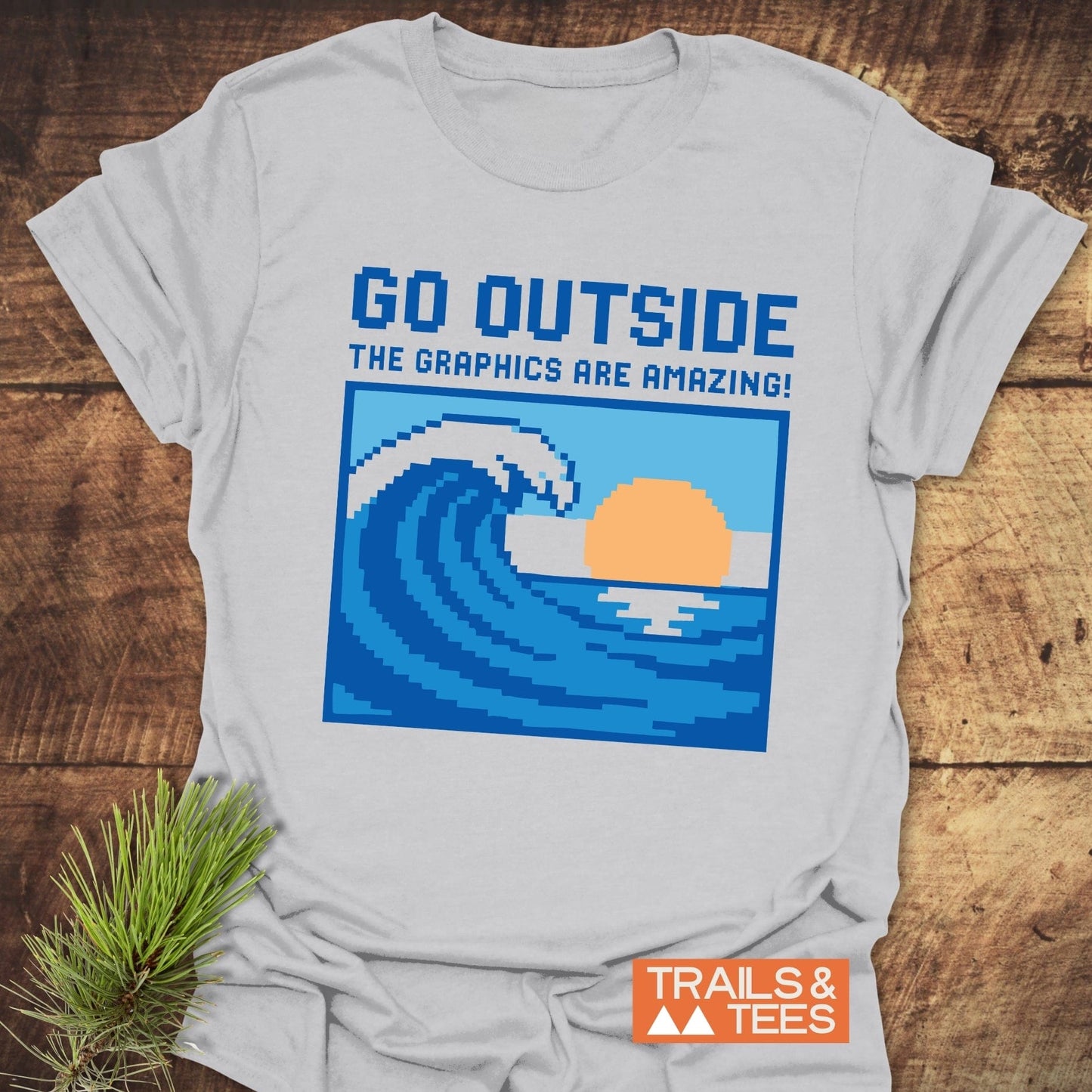 Go Outside Pixelart Wave T-Shirt featuring blue text design on soft, lightweight ring-spun cotton, perfect for outdoor adventures with durable, crack-resistant prints.
