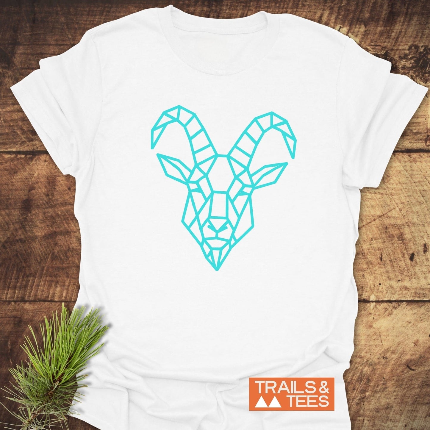 Geometric Mountain Goat T-Shirt featuring blue line art of a goat and blue diamond patterns, crafted from lightweight ring-spun cotton for everyday outdoor adventures.