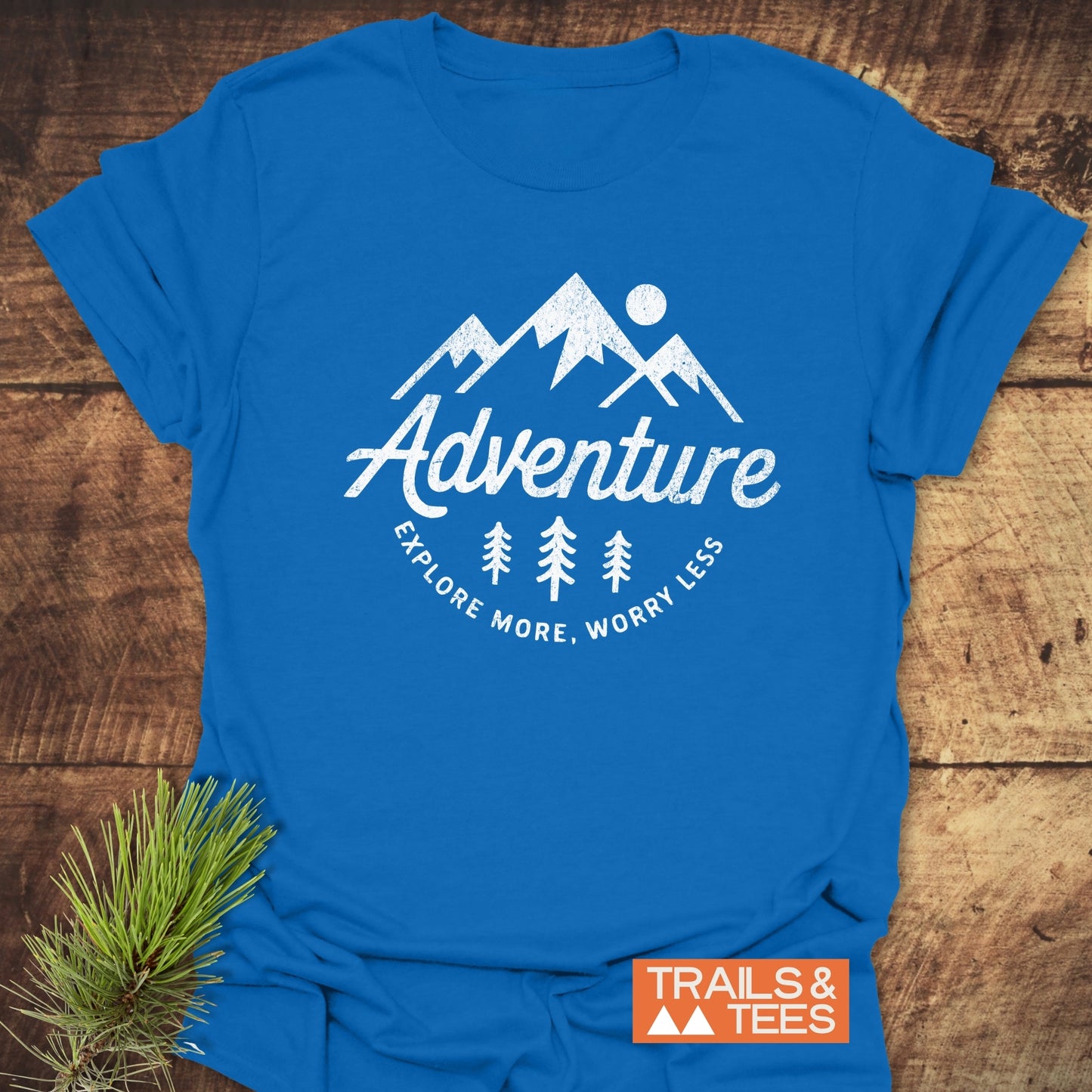Adventure - Explore More. Worry Less T-Shirt featuring a close-up of a white letter and arrow, highlighting its durable design and lightweight ring-spun cotton fabric.
