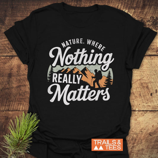 Nature. Where Nothing Really Matters T-Shirt featuring white text and a pine branch design, crafted from ring-spun cotton for comfort and durability, ideal for outdoor enthusiasts.
