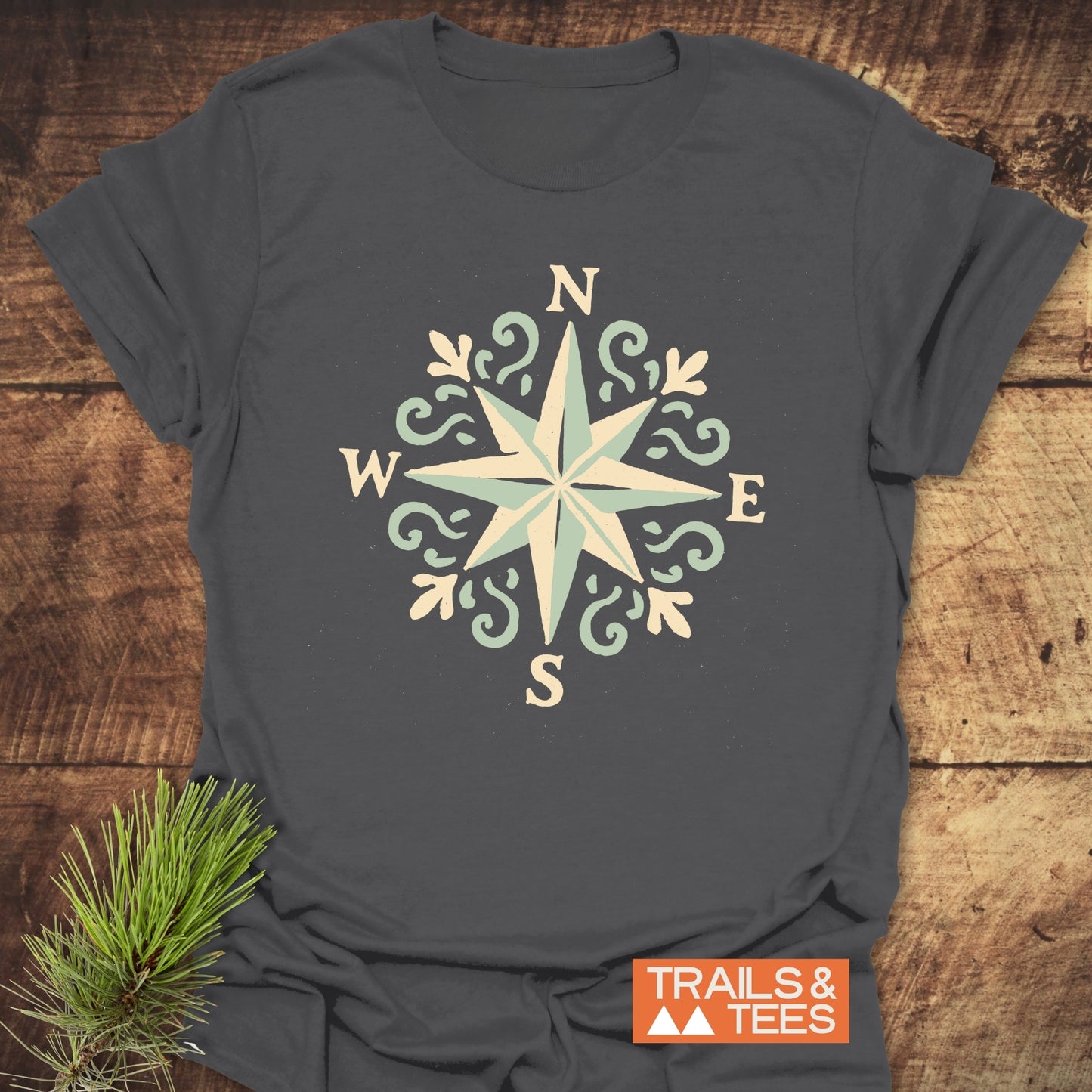 Compass Rose T-Shirt featuring a compass design, crafted from soft ring-spun cotton, offering comfort and durability for outdoor enthusiasts.
