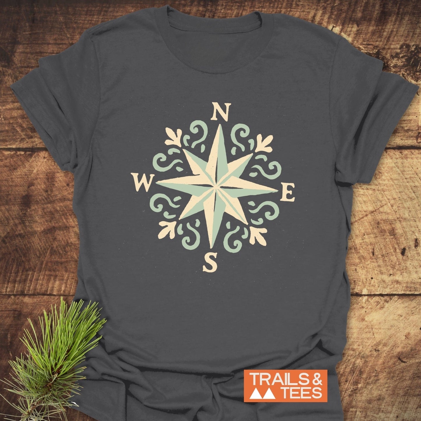 Compass Rose T-Shirt featuring a compass design, crafted from soft ring-spun cotton, offering comfort and durability for outdoor enthusiasts.