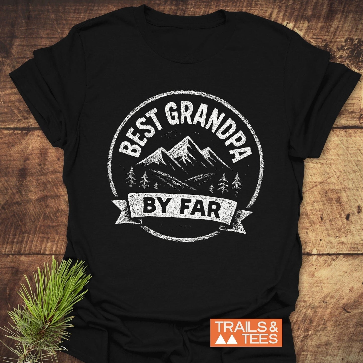 Black T-shirt featuring a distressed mountain logo with BEST GRANDPA BY FAR, highlighting durability and comfort for outdoor enthusiasts.