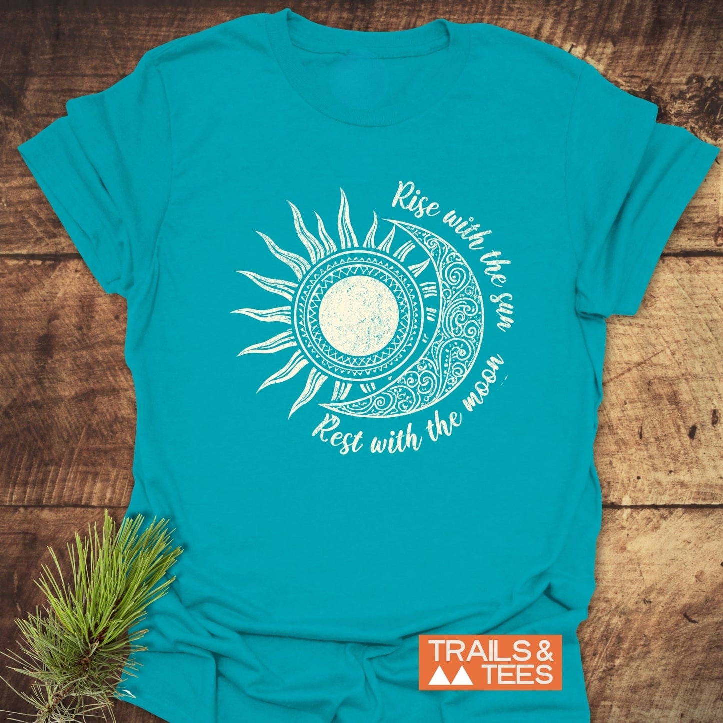 Sun & Moon Mystical Boho T-Shirt with a celestial graphic. Crafted from soft cotton, it’s ideal for outdoor adventures, featuring durable prints and a pre-shrunk fit.
