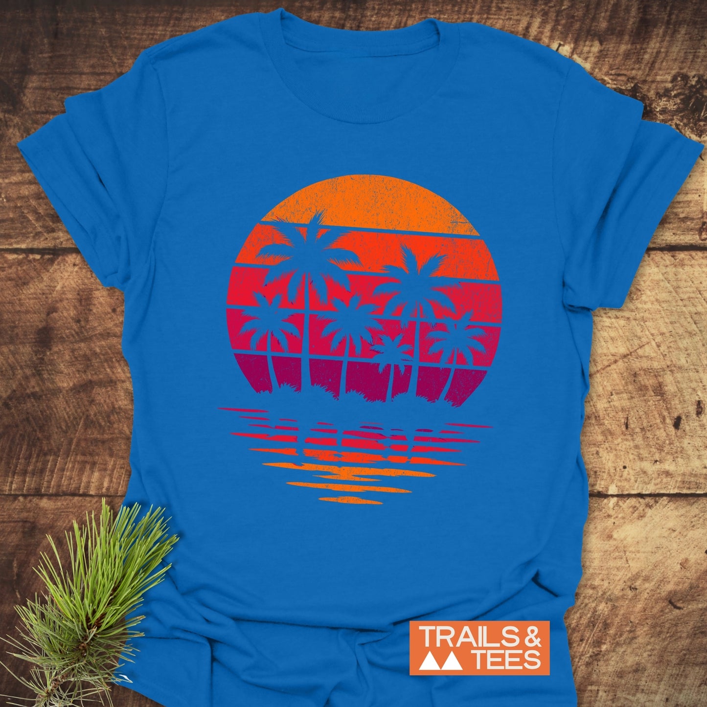 Retro Palm Trees T-Shirt featuring blue palm tree silhouettes and sun design, crafted from soft ring-spun cotton for comfort and durability.